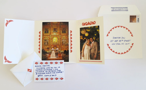 They also held a folded card with a couple photos from the wedding.