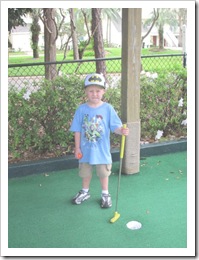 Florida vacation at condo twin posing at golf course