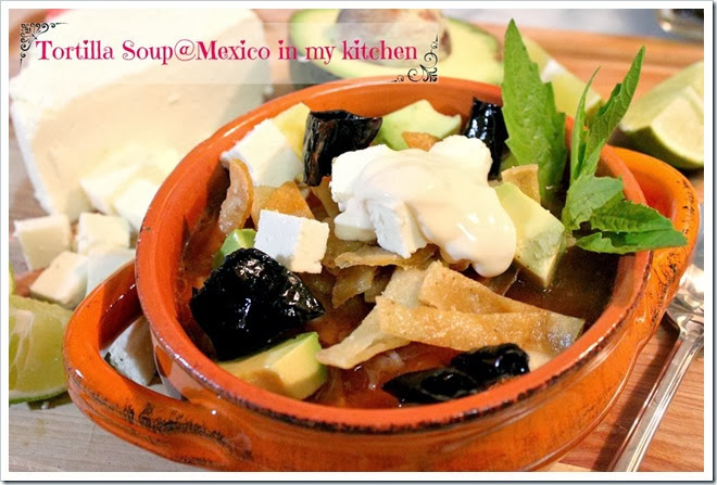 tortilla soup recipe with cubed cheese and fried pasilla peppers