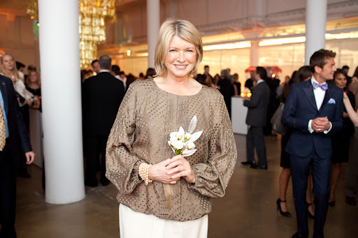 Martha enjoying the party with a nosegay by Matthew Robbins.