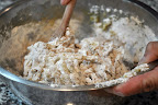 Following the directions, Betsy stirs in the all-purpose and whole-wheat flours, until the dough becomes sticky.

Photo by:  Samantha Kuvin