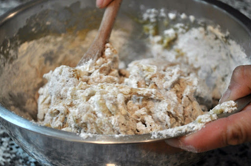 Following the directions, Betsy stirs in the all-purpose and whole-wheat flours, until the dough becomes sticky.
Photo by: Samantha Kuvin Following the directions, Betsy stirs in the all-purpose and whole-wheat flours, until the dough becomes sticky.
Photo by: Samantha Kuvin