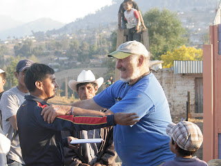 Manual, town elder, and Marty at the closing ceremonies. Photos by TOM HART