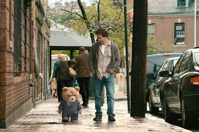 John (MARK WAHLBERG) walks his best friend, Ted (voiced by SETH MACFARLANE), to a job interview in the live action/CG-animated comedy "Ted".  