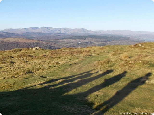 the shadows with supporting acts. Coniston fells in the distance