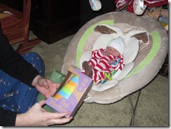 Daddy helping Zoey opening gifts3