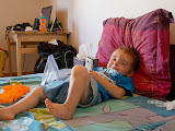 Matimu relaxing in bed playing with Lora's phone - he's growing up so fast! Madagascar6 - 111.jpg