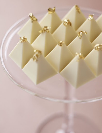All that's needed to turn these elegant white-chocolate zabaglione pyramid truffles into a wedding-worthy dessert is a whimsical topper of edible gold leaf on each one; display them together on a tall cake stand for a dramatic presentation. (Martha Stewart Weddings)