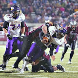 The Grizzliesâ Bobby Alt and John Kanongataâa sack the quarterback.