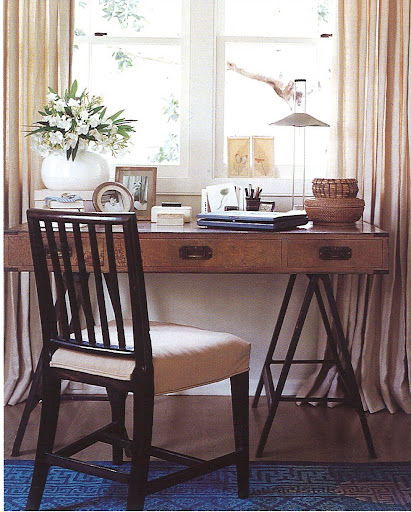 Lovely campaign desk - but the first thing I noticed in this photo was the bright blue rug. It works really well with the beige and wood tones.