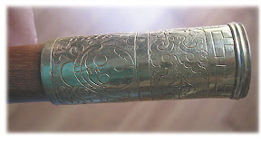 Brass mouthpiece with skull