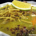 Kao Soy (Chiang Mai noodle soup with crispy and soft egg and rice noodles topped with chicken, cilantro & pickled mustard )