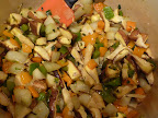 Stir in the mushrooms and cook a couple of minutes.
