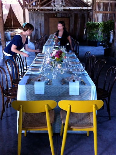 Danielle from Brown Paper Design, and Alyssa from Alison Events, put the finishing touches on the tables.