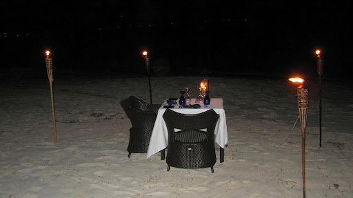 One a calm evening we enjoyed a romantic dinner in the sand.