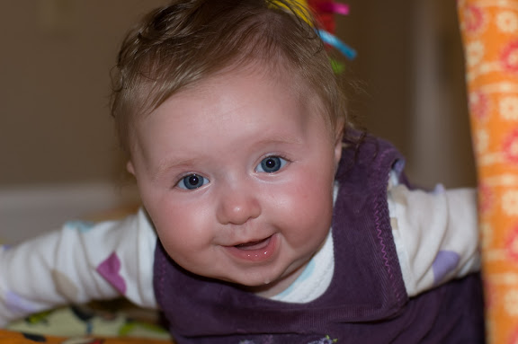 She doesn't really enjoy Tummy-time, but I was able to get some smiles out of her... drool in all.