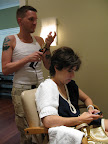 Our hair stylist Jerami and me (multitasking in the chair) prep for my editor's letter portrait.
