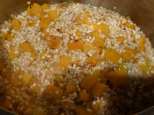 Add rice to the pot with the squash and onion.