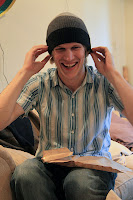 Julian trying on his Secret Santa present