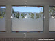 Etched glass above tub.