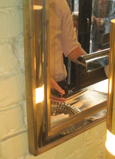 See the Higgins glass bowl with the business cards in the reflection? Plus, the mirror and lamp are divine.