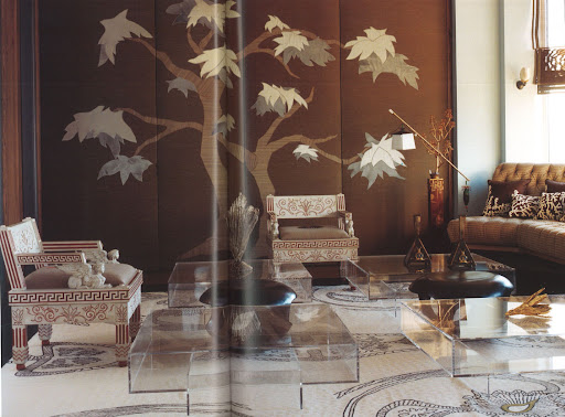 More exotic wall graphics are modernized with a quartet of edgy class coffee tables.