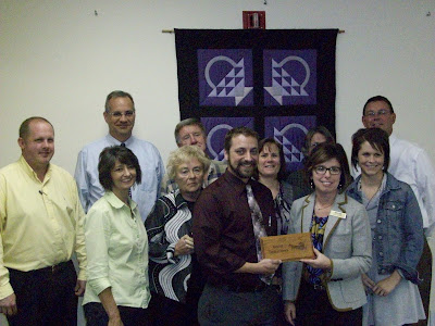Back Row (L-R):  Ryan Schlabaugh, Grace Schumann, Dave Hochstetler, Grace Schumann, Jan Peterseim, Larry Moeller, Judy Showalter, Dan Ehl, Bobbie Peiffer, Doug Yotty.  Front Row:  KCII General Manager Joe Nichols, Chamber of Commerce President Gloria Hochstedler