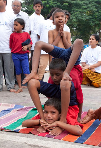 6. Despite the struggle of getting into such advanced poses, the partially blind child on the bottom was eager to smile for my camera.