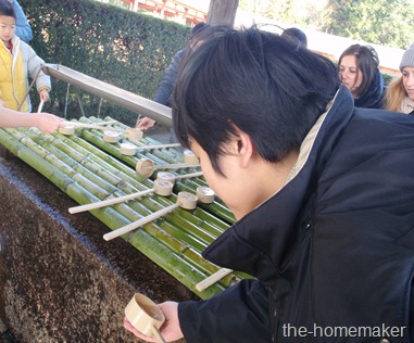 Howie taking holy water in Todaiji Temple, Nara