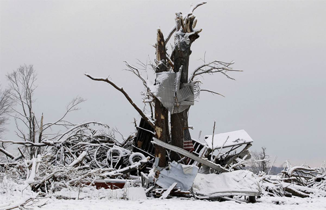 Snow covers the remains of a home demolished by a tornado in Marysville, Indiana, on Monday, 5 March 2012. MSNBC