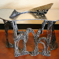 Arches table wbronze fish sculpture.jpg