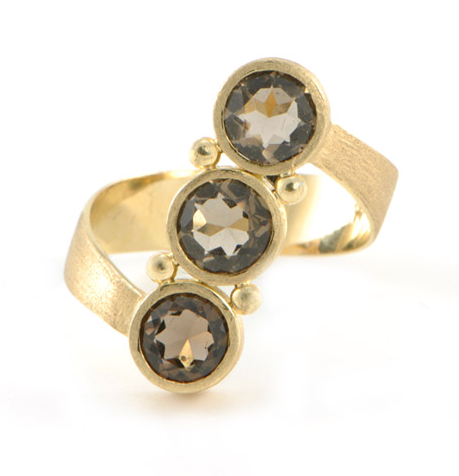 This 18k yellow-gold ring with faceted smoky topaz ($1,798) would look beautiful on your right hand.