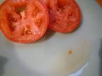 Tomato slices, salted to drain-see liquid pooling.