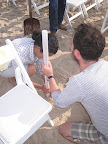 Katie and Daniel prepping the aisle poles.