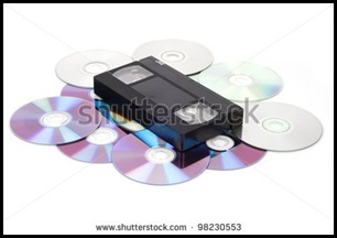 stock-photo-cd-vs-vhs-vhs-cassette-lay-on-the-many-cd-disks-98230553