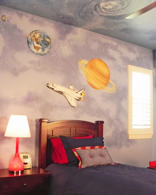 We created a fun and colorful outer space themed bedroom for three-year-old little Gabriel.