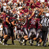 Defense celebrates after forcing a fumble late in the game.  Dan Moore would score shortly after.  Washington - Grizzly Stadium, Montana Grizzlies vs. South Dakota Coyotes.  Missoula, MT, September 1st, 2012.