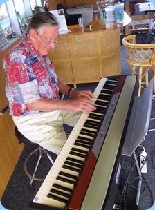 Roy Steen giving the Club's portable digital piano a whirl.