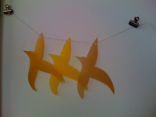 To test out the vellum bird garland, Jen hung it on the wall.