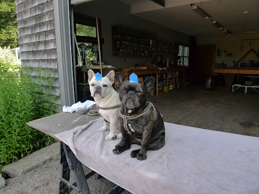 Martha gave Uncle Carlos a job painting a table and he thought it would be so funny to make little hats for us using the painters' tape.