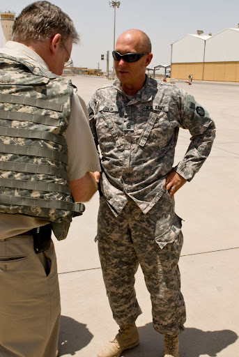 Missouri Gov. Jay Nixon talks with Command Sgt. Maj. Douglas Julin, senior enlisted leader, Multi-National Division - South, upon arriving at the Basra airfield during a visit to MND-S headquarters at Contingency Operating Base Basra, Iraq July 19. Nixon came to COB Basra as part of a three-governor tour which included Minnesota Gov. Tim Pawlenty and Nevada Gov. Jim Gibbons. (U.S. Army photo by Sgt. Frank
Vaughn)