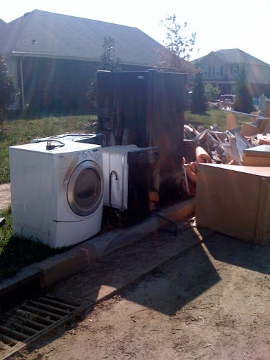 Ruined appliances still line the streets.
