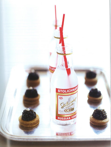 Another great way to serve caviar is on buckwheat blinis. Small bottles of vodka outfitted with straws complete this pairing. Another great way to serve caviar is on buckwheat blinis. Small bottles of vodka outfitted with straws complete this pairing.