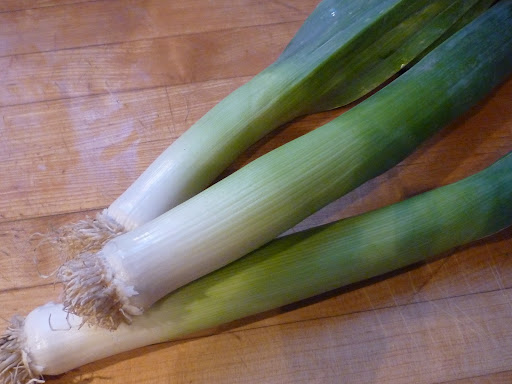 Leeks, which are a part of the onion family, have a mellow, onion flavor.
