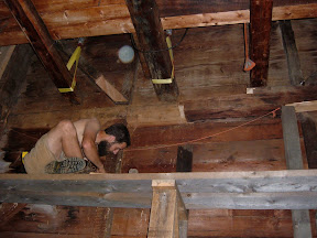 One floor below the girts that had rolled, another girt had significant rot.  The floor joists were suspended while the rotten portion of the girt was repaired.