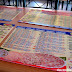 Tables are adorned with menu placemats at Mamma Maria's Pizzeria