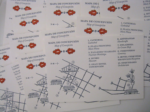 The maps were stamped with small orange accents.