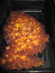 Chicken breaded (on one side only) with dry bread crumbs.