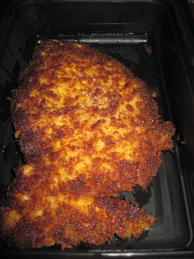 Chicken breaded (on one side only) with dry bread crumbs.