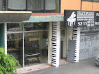 Pianos, however, are sold indoors in wittily-painted stores